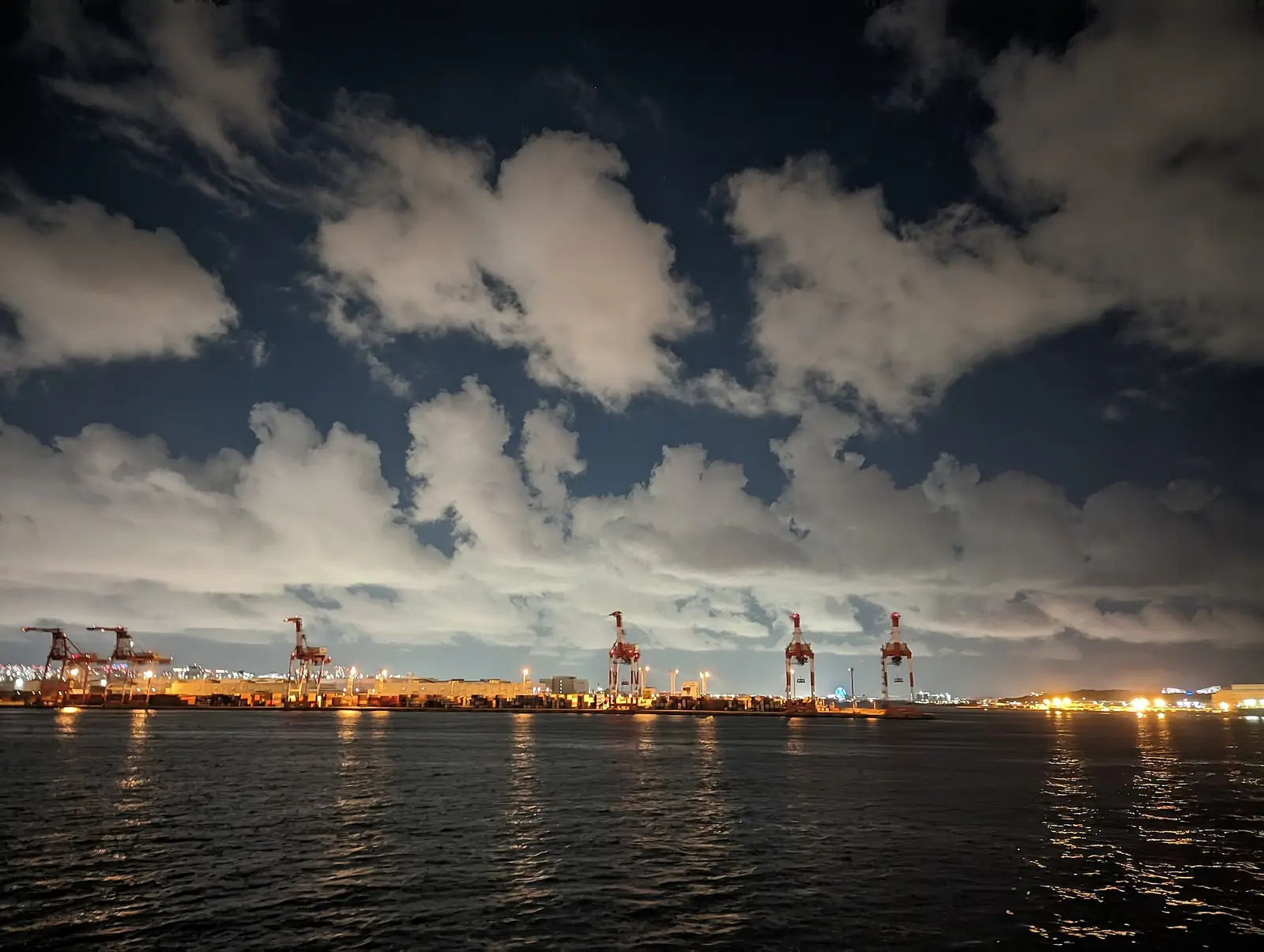 Container cranes at a port at night